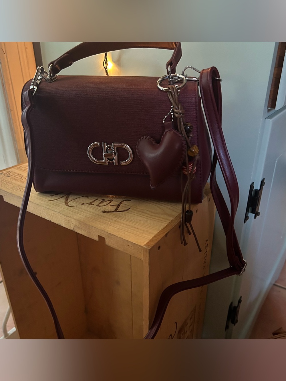 Women's Burgundy Turn Lock Crossbody Bag with Heart Charm Accent